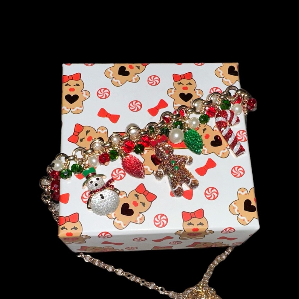 Holiday necklace with charms and gold tone necklace.